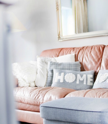 red-couch-grey-white-pillow-mirror