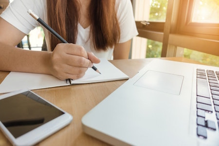 woman-writing-pencil-computer